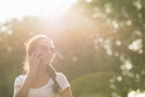 Young woman on cell phone — Stock Photo