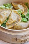 Dumplings in wooden bowl — Stock Photo