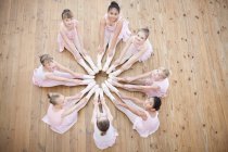 Young ballerinas in circle formation — Stock Photo