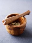 Wooden pestle and mortar — Stock Photo