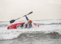 Young man sea kayaking — Stock Photo