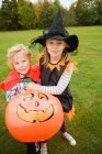 Portrait of  cute blond Children wearing Halloween costumes — Stock Photo