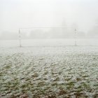 Soccer goal on frosty field — Stock Photo