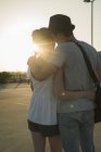 Romantic young couple in empty parking lot — Stock Photo