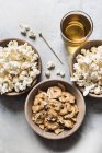 Bowls of popcorn and pretzel crackers — Stock Photo
