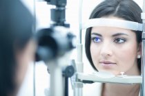 Young woman having eye examination — Stock Photo
