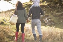 Mid adult couple on walk holding hands — Stock Photo