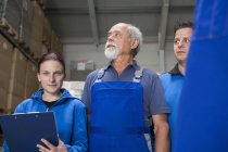 Portrait of team of factory workers — Stock Photo