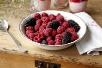 Bowl of berries on table — Stock Photo