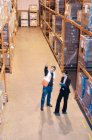 Worker and supervisor in warehouse — Stock Photo