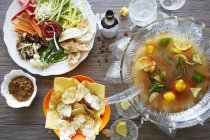 Still life of punch cocktail bowl with party food — Stock Photo