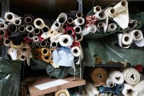Rolls of fabric in textiles factory — Stock Photo