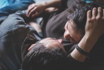 Couple embracing, face to face, overhead view — Stock Photo