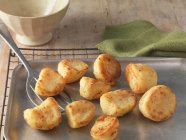 Roast potatoes on baking tray — Stock Photo