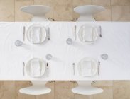 Top view of set table with tableware and cloth napkins — Stock Photo