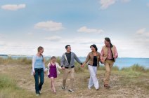 Family walking together outdoors, selective focus — Stock Photo