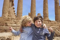 Portrait of brothers in front of the Temple of Concordia, Agrigento, Sicily, Italy — Stock Photo