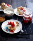 Plate of strawberry shortcake with cream — Stock Photo