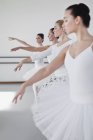 Ballet dancers posing in studio — Stock Photo
