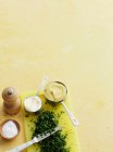 Spices, mustard, mayonnaise and slices herbs on table — Stock Photo