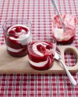 Raspberry swirl desserts garnished with fresh raspberries — Stock Photo