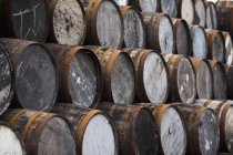 Stack of wooden whisky casks — Stock Photo