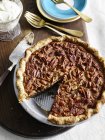 Top view of pecan pie with slice missing — Stock Photo