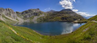 Scenic view of alps and lake, Colle del Nivolet, Piedmont, Italy — Stock Photo