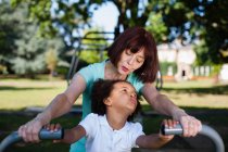 Woman and granddaughter playing in park — Stock Photo