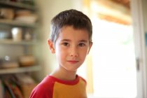 Portrait of adorable boy looking at camera — Stock Photo