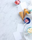 Bowls of ice cream and cones — Stock Photo