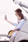 Couple taking picture of themselves — Stock Photo