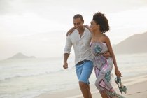Romantic couple strolling on beach, Rio De Janeiro, Brazil — Stock Photo