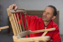 Carpenter working on chair — Stock Photo