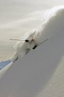 Skier turning in deep powder snow. — Stock Photo