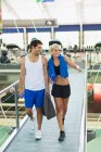 Couple walking together in gym — Stock Photo