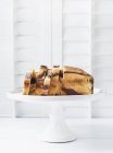 Marbled cake on white cake stand — Stock Photo