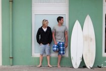 Teenage boys standing with surfboards — Stock Photo