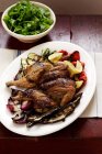 Butterflied roast chicken with rocket salad — Stock Photo