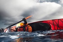 Kayaker flipped over in water — Stock Photo
