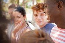 Group of students laughing outdoors — Stock Photo