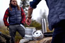 Male hikers cooking in camp, Lapland, Finland — Stock Photo