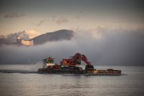 Excavator on barge at Lake Maggiore, Varese, Piemonte, Italy — Stock Photo