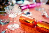 Close up of Christmas cracker on table — Stock Photo
