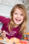 Portrait of Girl laughing in the kitchen — Stock Photo