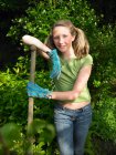 Girl working in the garden — Stock Photo