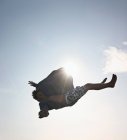 Teenage boy posing in mid-air — Stock Photo