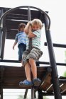 Boys playing on play structure together — Stock Photo