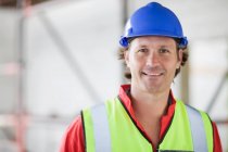 Smiling worker with hat — Stock Photo