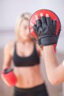 Young woman training in gym — Stock Photo